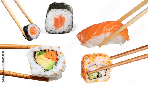 Fotografía Assorted Japanese sushi rolls and salmon nigiri collection held with wooden chop