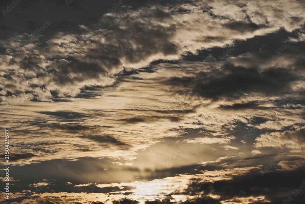 Obraz premium Dramatic Sky with Cloud Layers at Sunset