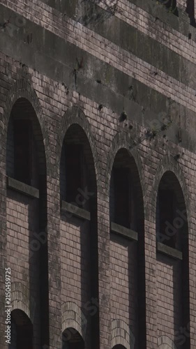 Red brick old derelict building window arch facade