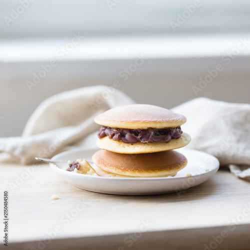 Japanese dorayaki pancakes filled with red bean paste stacked on plate