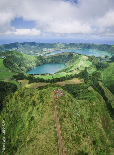 Aerial drone view of Miradouro da Grota do Inferno overlooking the volcanic lakes and lush landscape of Sete Cidades, Sao Miguel, Azores, Portugal.