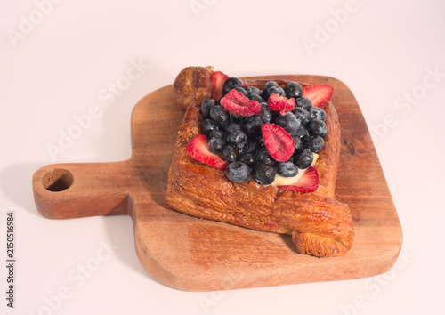 Quadro su tela Gourmet fruit Danish pastry on wood serving board