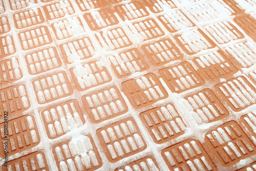 Back Side Of Red Ceramic Tile Texture With Grid Pattern And White Residue