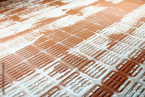 Back Side Of Red Ceramic Tile Texture With Grid Pattern And White Residue