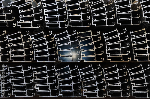 Stacked thermal break aluminum alloy window profiles stored in factory workshop