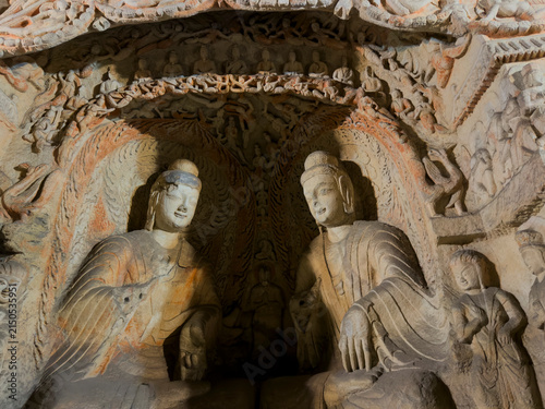 Canvastavla Yungang Grottoes displaying carved Buddha and bodhisattva figures