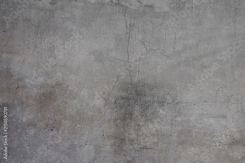 Abstract concrete background with cracks and voids.