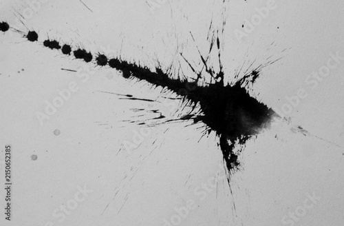 Abstract black ink splatter with a bold textured stroke, scattered droplets, fine spray marks, and expressive brush details. A dynamic hand drawn ink effect suitable for posters, comics, branding.