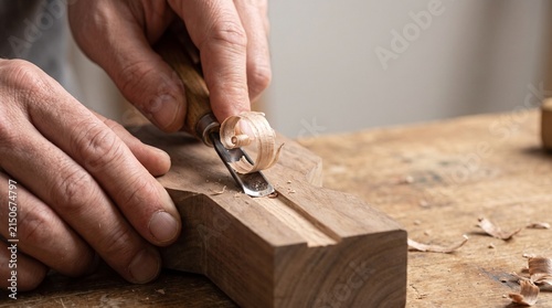 Fresh Curled Wood Shaving Produced by Hand Carving Tool During Woodworking