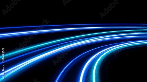 Abstract blue neon light trails swirling in dark motion blur for futuristic tech design