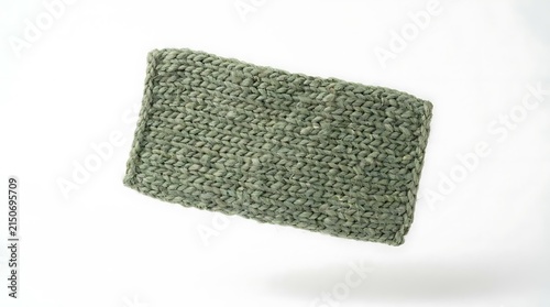 Rectangular green knitted fabric swatch on white background.