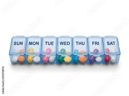 Weekly pill organizer with colorful medication compartments isolated on white background