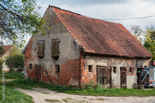 Old brick house with weathered facade in Gvardeysk, Russia