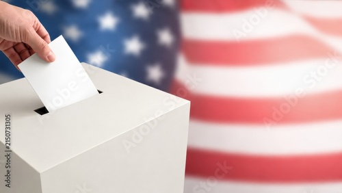 Person casting vote in ballot box with American flag background