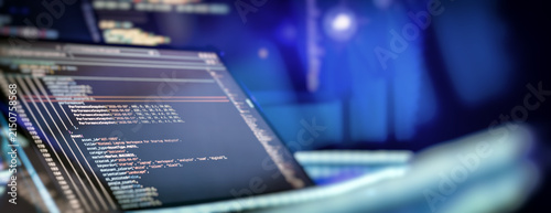 Programming code on laptop screen showing data analytics and software development process with copy space.