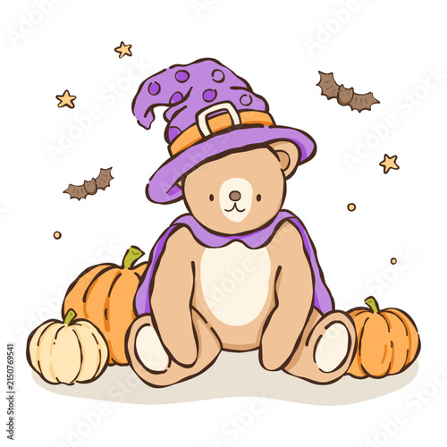 a teddy bear wearing a witch hat and holding pumpkins