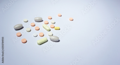 Принти на полотні pills on a white background. Colorful health supplements.