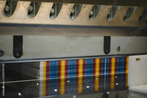 Obraz na plátně Stacking paper sheets cut by guillotine in printing house