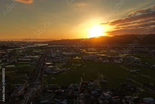 Konstfotografi Aerial drone photo of Wakayama city streets, farmland and river at sunset in sum