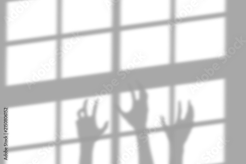 A scary shadow of human hands reaching up behind a window frame overlay effect for creative design projects isolated on transparent background