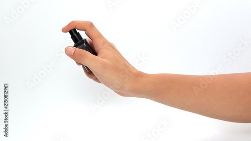 Bild auf Leinwand Asian Hand Pressing Black Perfume Spray Atomizer Isolated on White Background wi