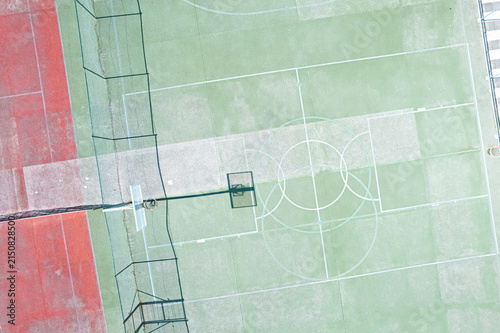 Overhead view of empty basketball court with hoop shadow The Concept of urban recreation