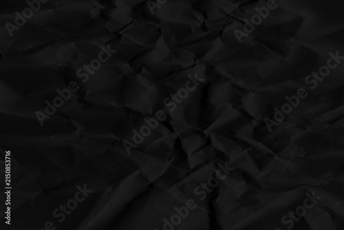 Obraz na płótnie Black crumpled paper texture, abstract creased surface with subtle shadows and f