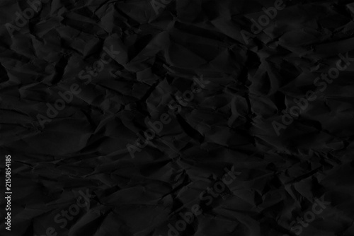 Cuadro en lienzo Dark black crumpled paper texture with subtle shadows and creases, abstract mono