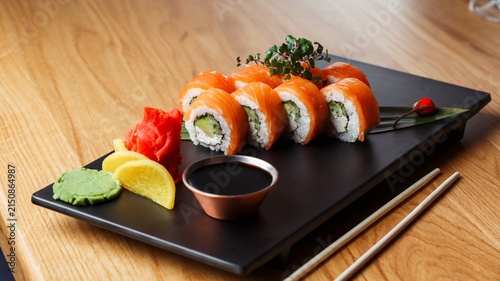 Canvastavla Salmon Sushi Roll Set with Soy Sauce, Wasabi, Pickled Ginger and Chopsticks on W
