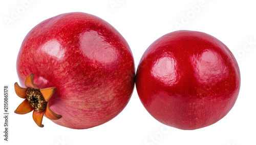 Isolated two whole fresh ripe pomegranates, a vibrant and nutritious ruby red superfood fruit