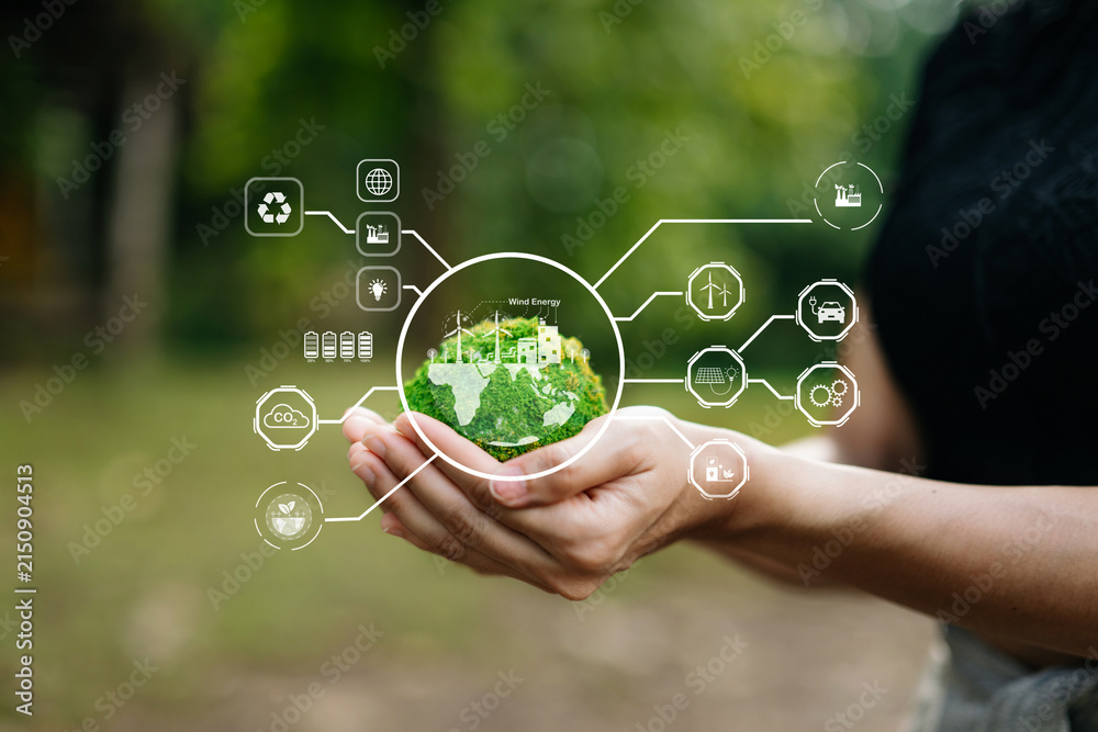 Obraz premium Hand holding a mossy earth globe with carbon neutral and green energy HUD icons for environmental conservation
