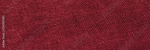 Burgundy linen fabric texture background, dark red woven textile material with natural fiber detail, maroon cloth surface for fashion design and interior upholstery backdrops