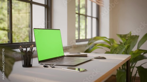 Laptop PC with Green Screen on Office Desk in Sunny Room - Perspective View, Looped Video