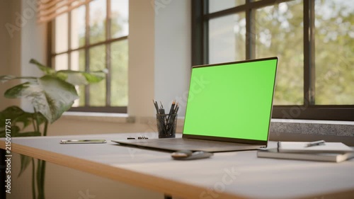 Laptop PC with Green Screen on Office Desk in Sunny Room - Perspective View, Looped Video
