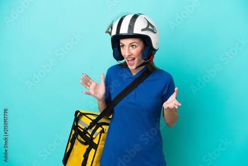 Quadro su tela Young caucasian woman with thermal backpack isolated on white background with su