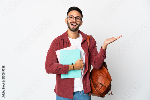 Foto Young student man isolated on white background with shocked facial expression