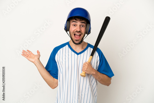 Foto Young caucasian man playing baseball isolated on white background with shocked f