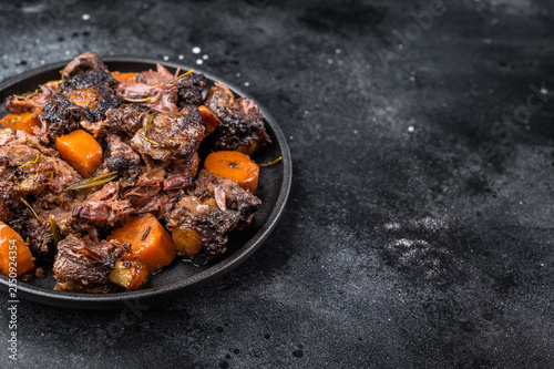 Картината върху платно Homemade beef and lamb oxtail ragout in skillet, gelatin rich slow cooked meat w