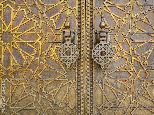 The detail of famous golden main entrance to the Royal Palace in Fès, Morocco