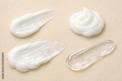 Beauty product samples on a light beige background.