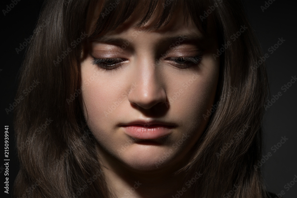 Fototapeta premium Beautiful teen girl portrait with makeup on dark background