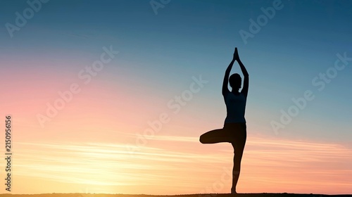 Silhouette of Woman Practicing Yoga in Tree Pose at Sunset Horizon