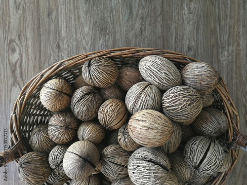Dry cerbera odollam seeds in a wicker basket