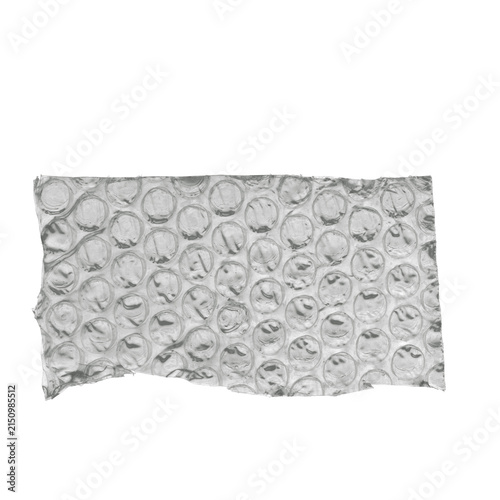 Crumpled silver aluminum foil strip with bubble wrap-like circular embossed texture on white background, metallic packaging material isolated
