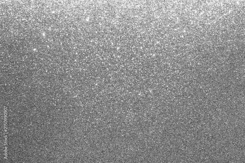 Silver glitter background with shimmering sparkle and metallic texture for festive designs