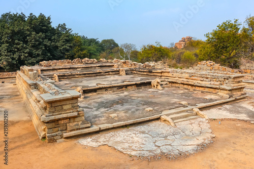 Bild auf Leinwand Ancient stone temple ruins and historic carved architecture in Hampi, India