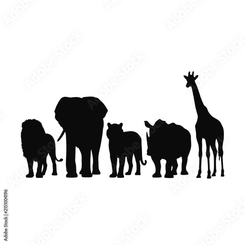 Photography Black silhouette of various african wild animals standing together isolated on a