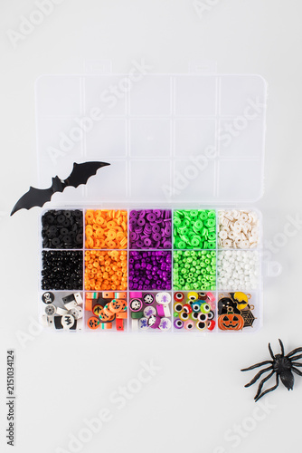 A set of multicolored beads for making handmade Halloween bracelets. 