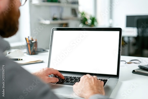 Man Typing on Laptop White Screen Mockup for Business Design