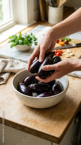 Fresh Eggplants Being Prepared For Culinary Delights In A Bright Kitchen Setting